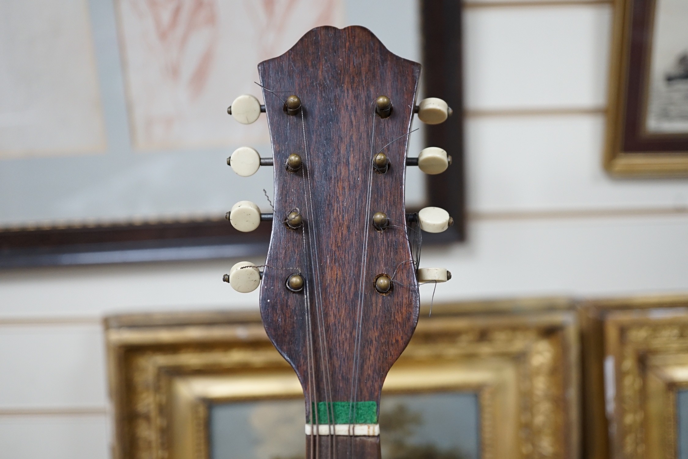 A late 19th century German violin together with an Italian mandolin, (both cased)